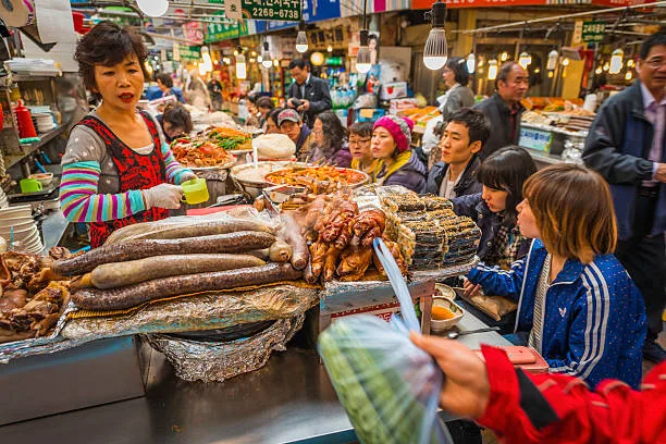 people eating at korean market street food